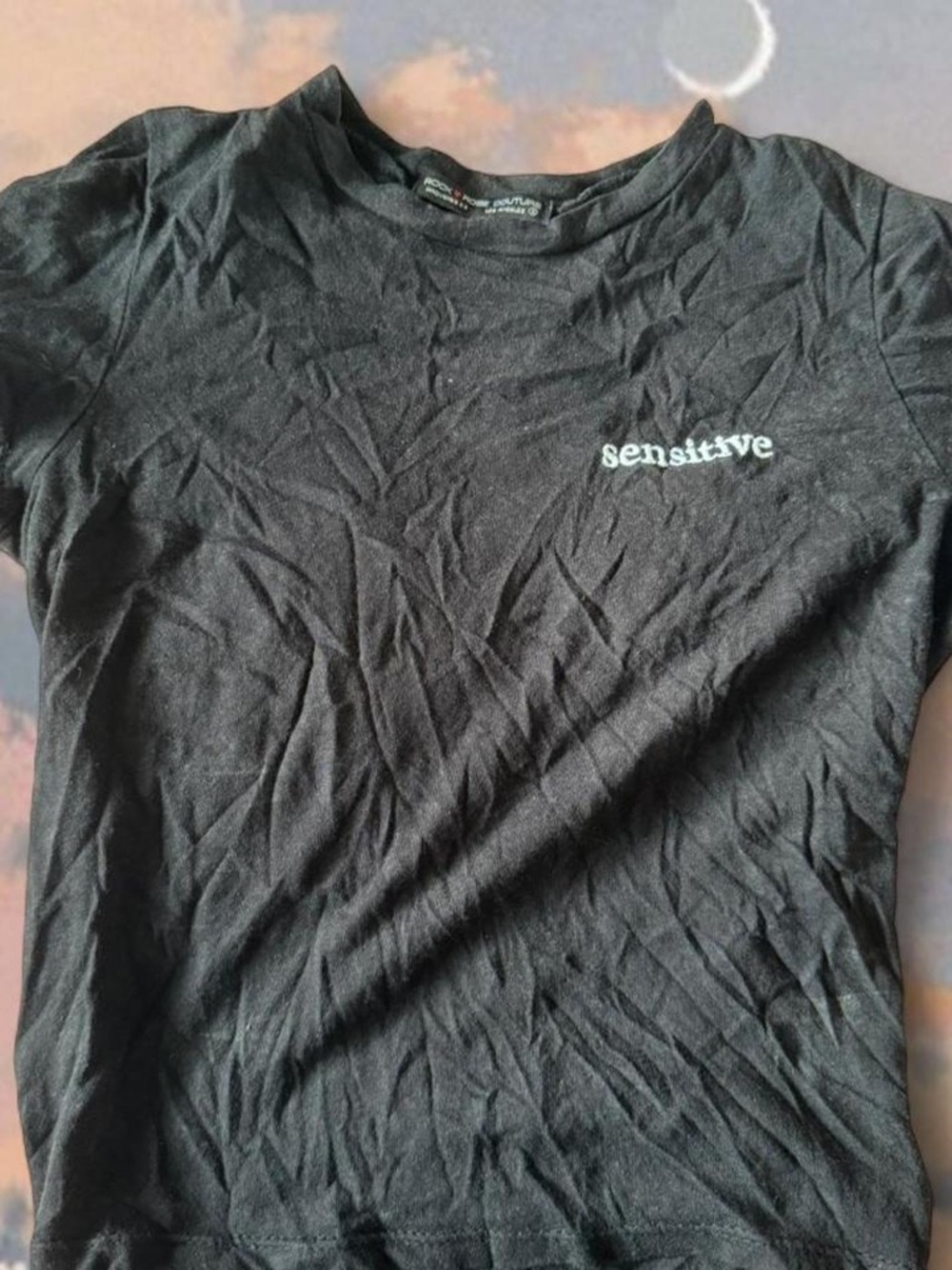 black "sensitive" tee